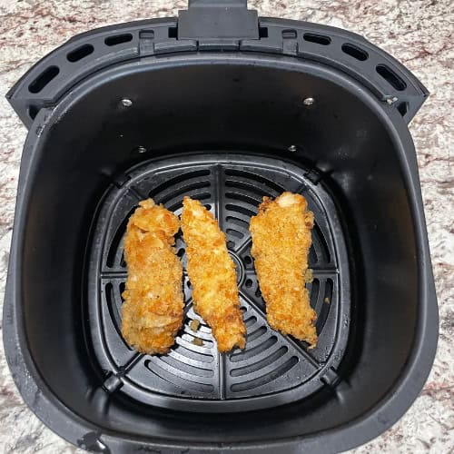 air fryer potato chip chicken tenders in air fryer basket