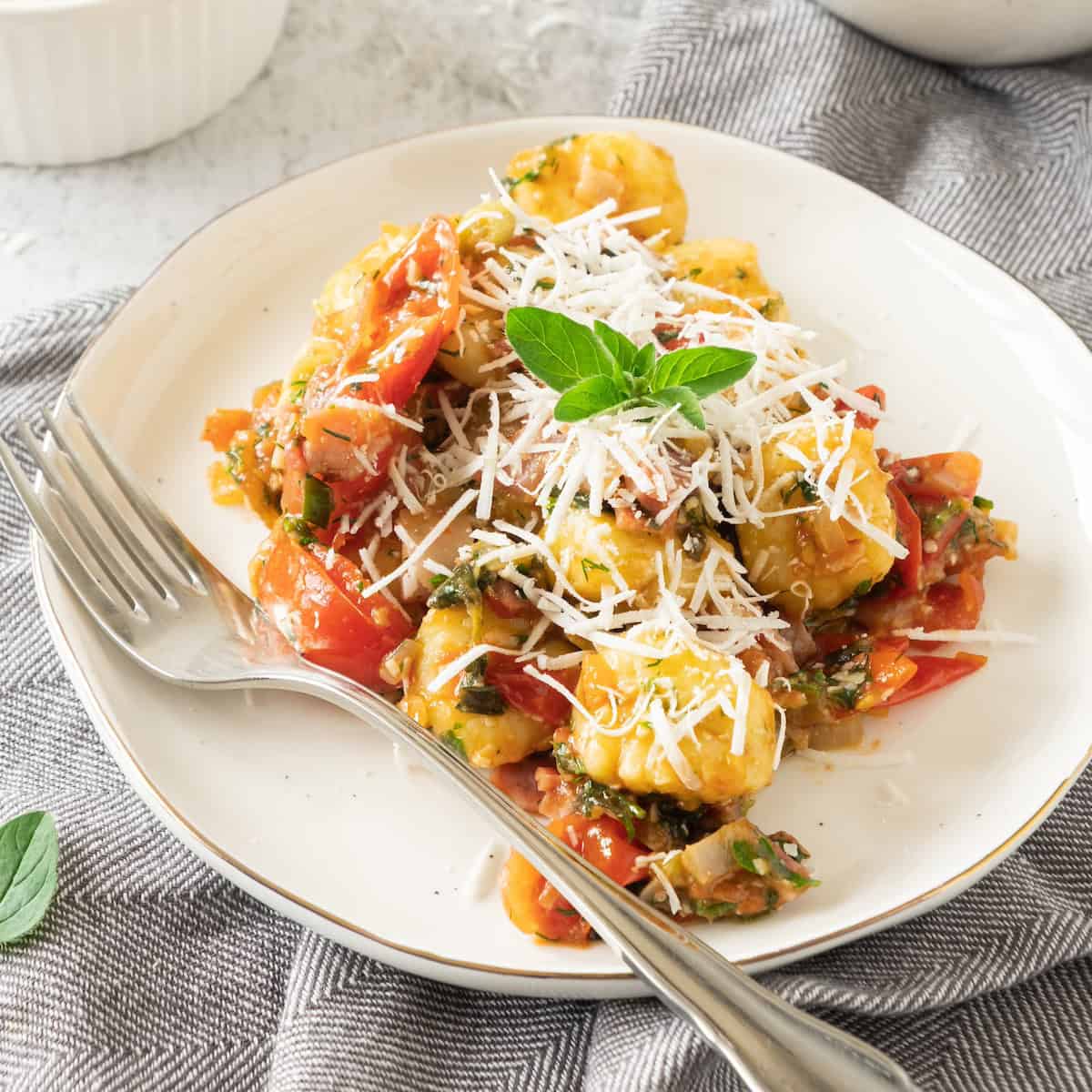 potato gnocchi with bacon on plate