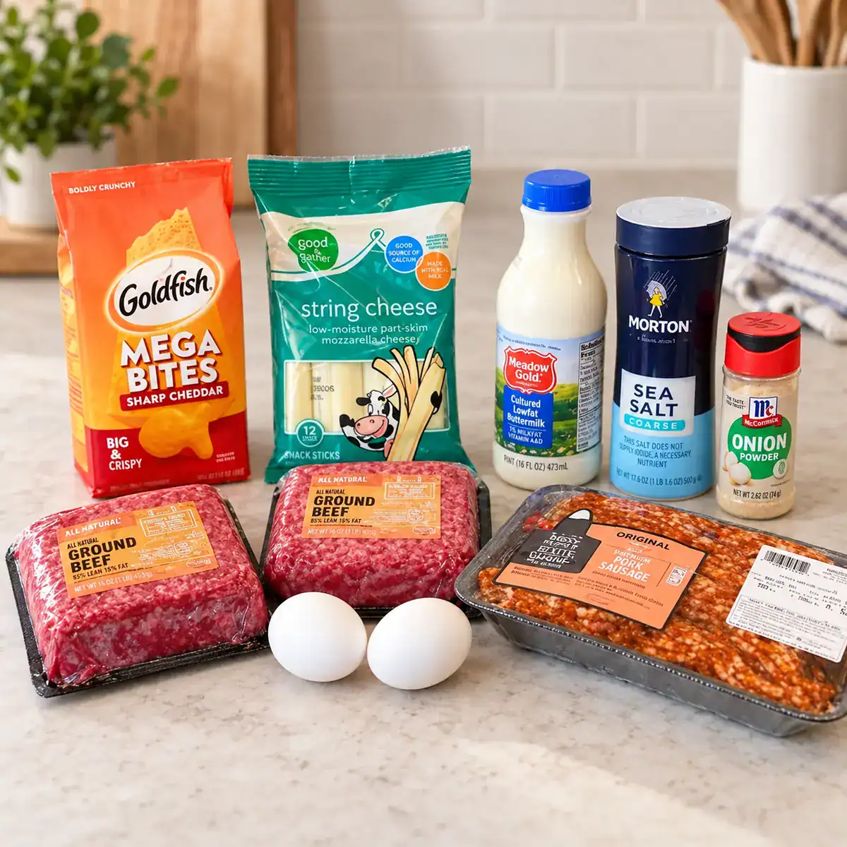 Ingredients for smoked cheese-stuffed meatloaf, including ground beef, sausage, cheese, eggs and seasonings