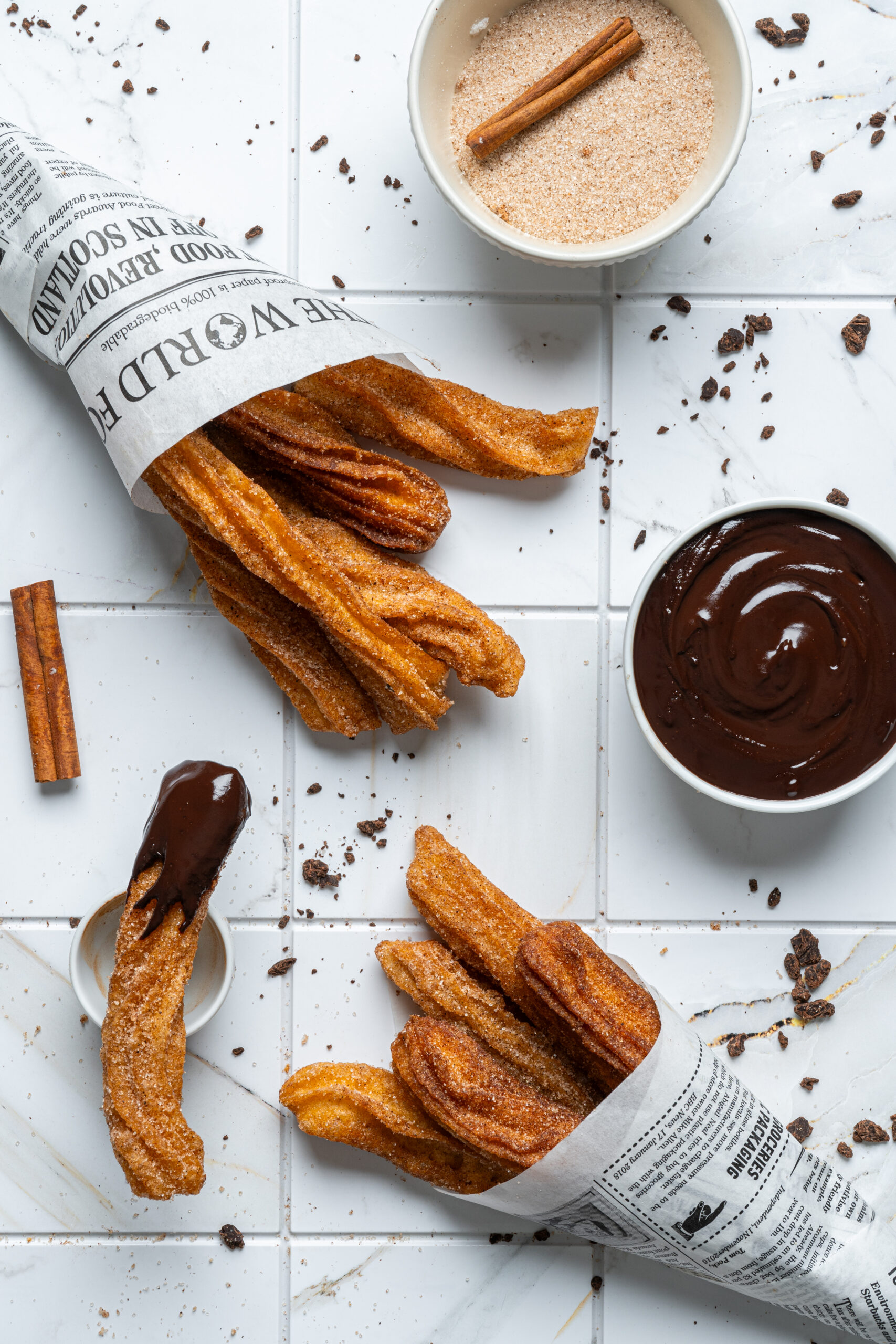 churros in newspaper with dip