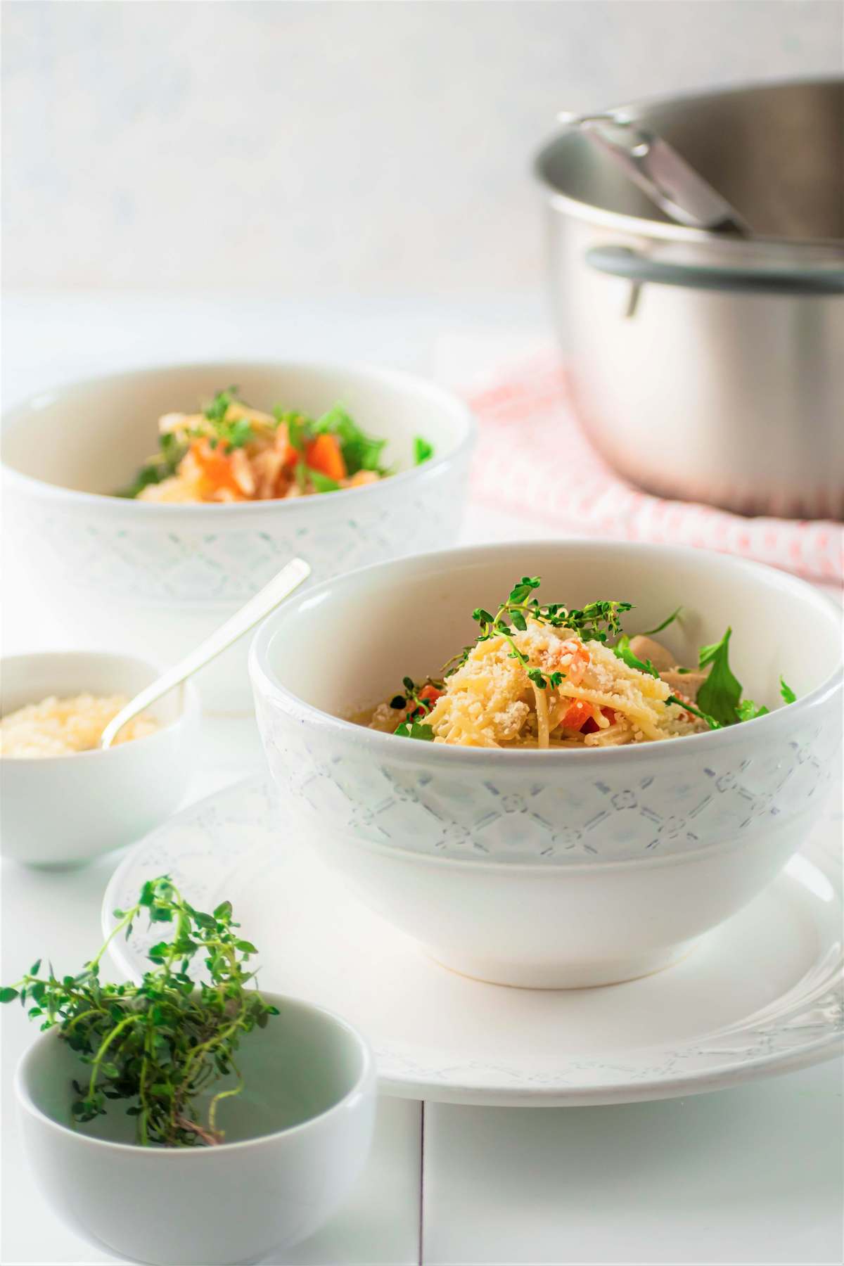 side view of two bowls of chicken soup