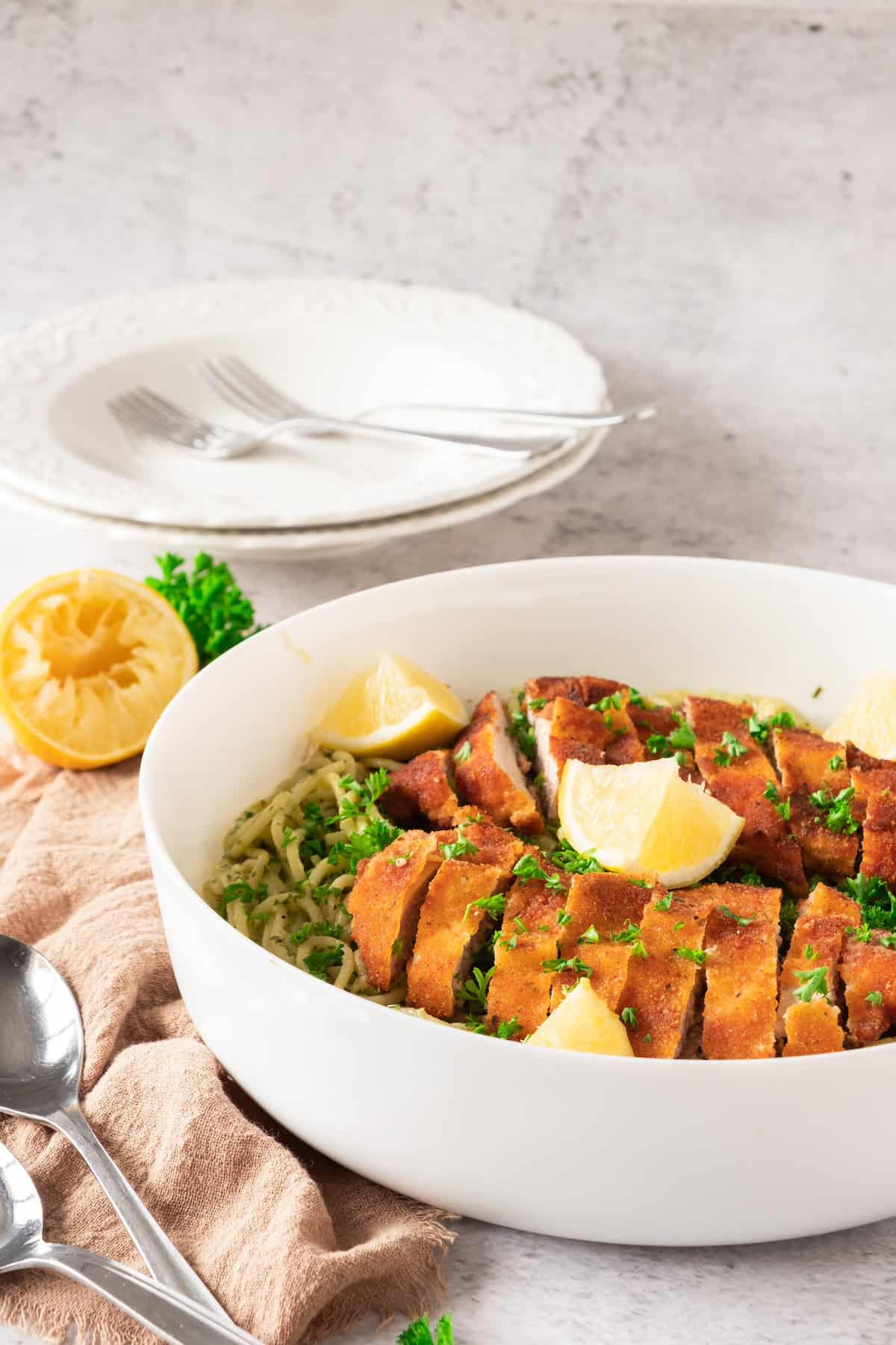 sliced crispy chicken and spaghetti in bowl