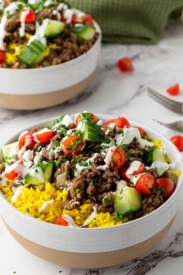 two halal cart beef rice bowls