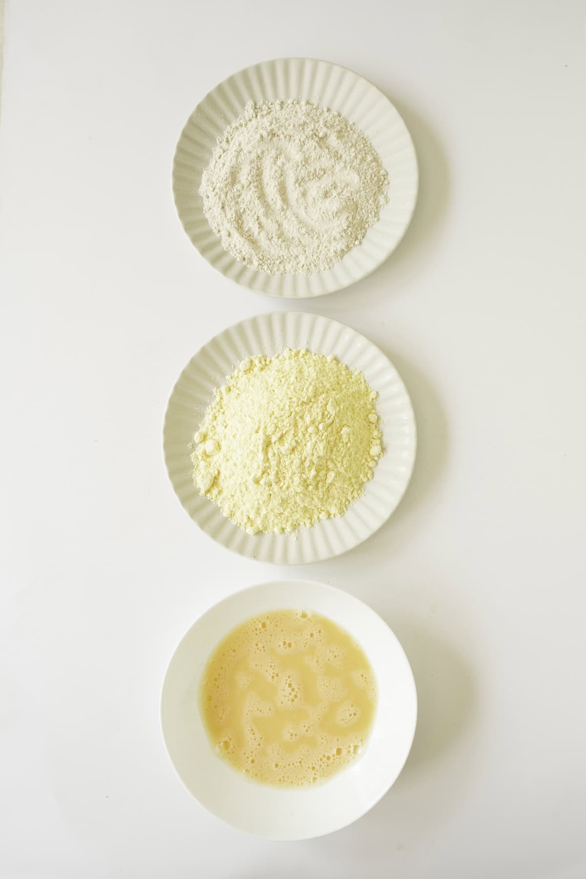 dishes of flour cornmeal and egg