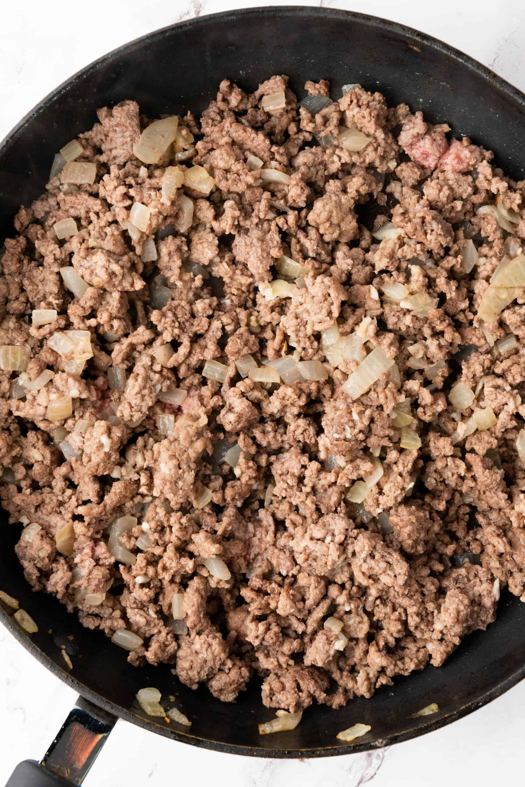 cooked ground beef in skillet