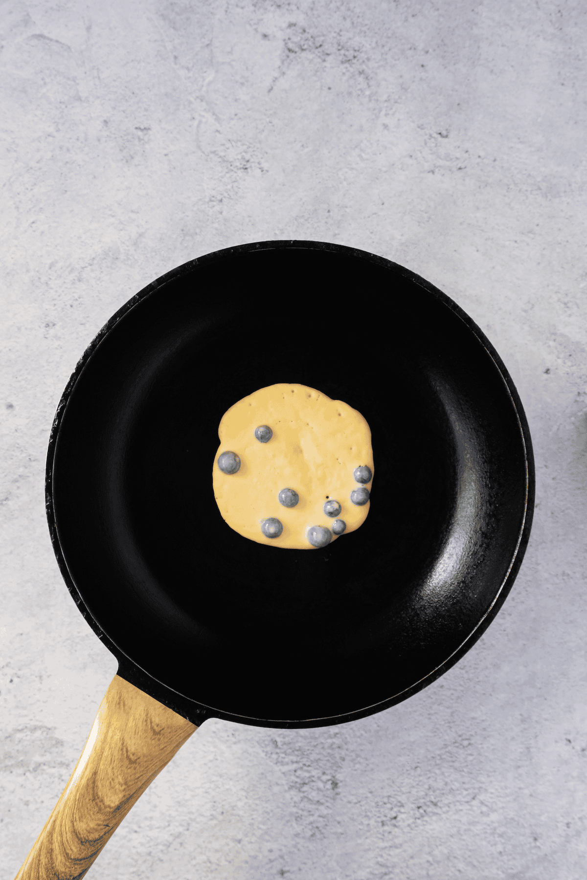 pancake batter cooking on skillet