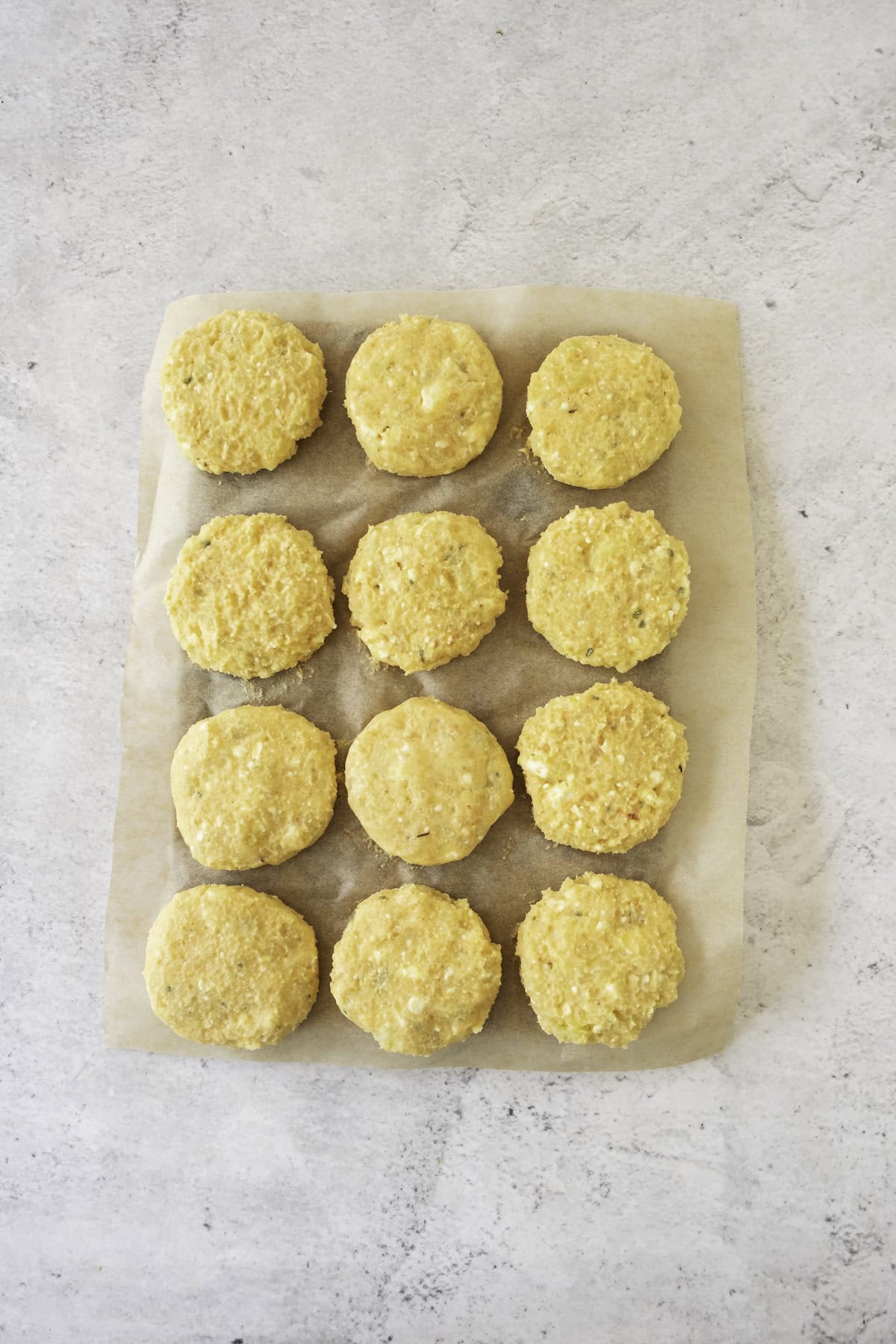 tray of raw potato fritter patties